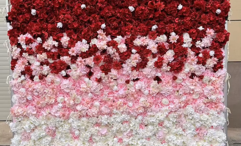 Red, pink, and white flower wall backdrop from RMJ Entertainment