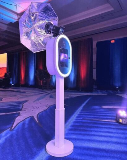 Experience Booth Pro photo booth with an illuminated screen at an indoor event